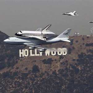 the endeavor flying over the hollywood sign in los angeles